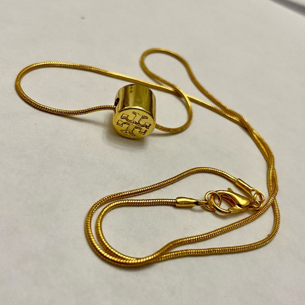 Tory Burch Gold Tone Charm with 18in Gold Plated Chain Necklace