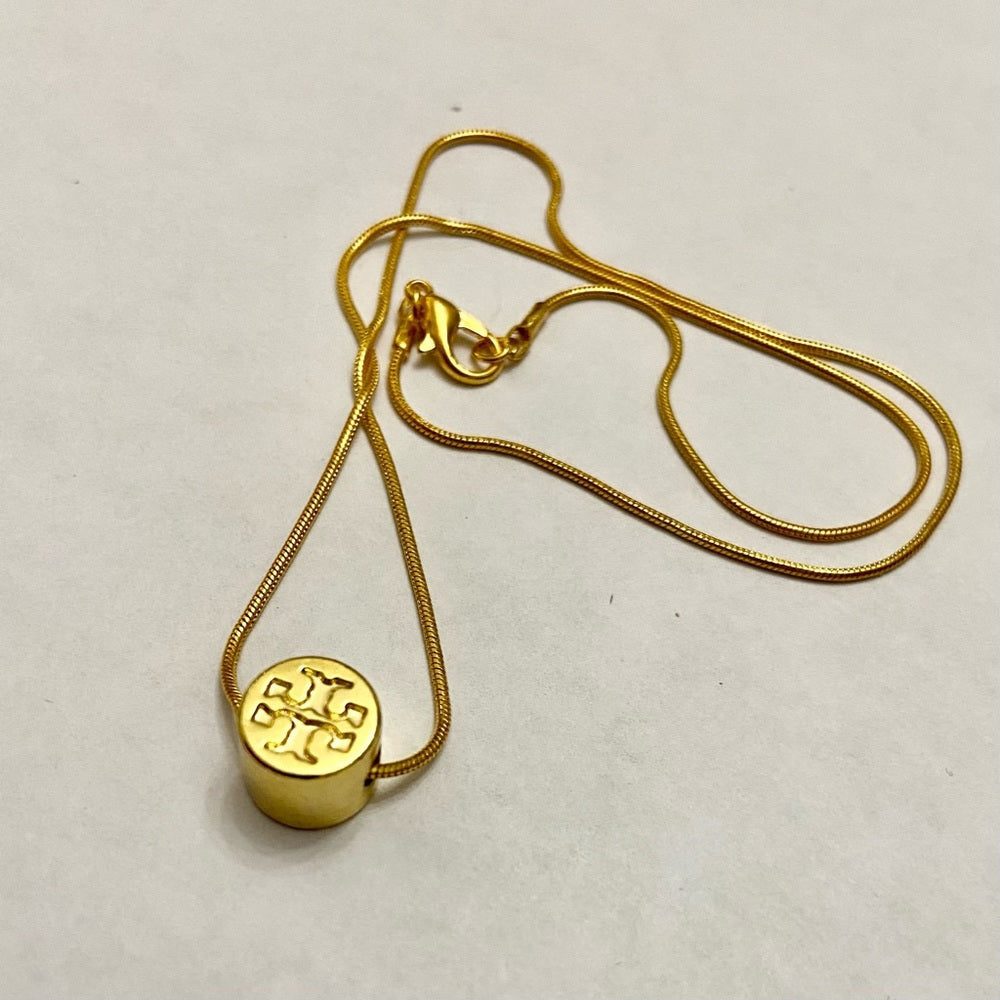 Tory Burch Gold Tone Charm with 18in Gold Plated Chain Necklace