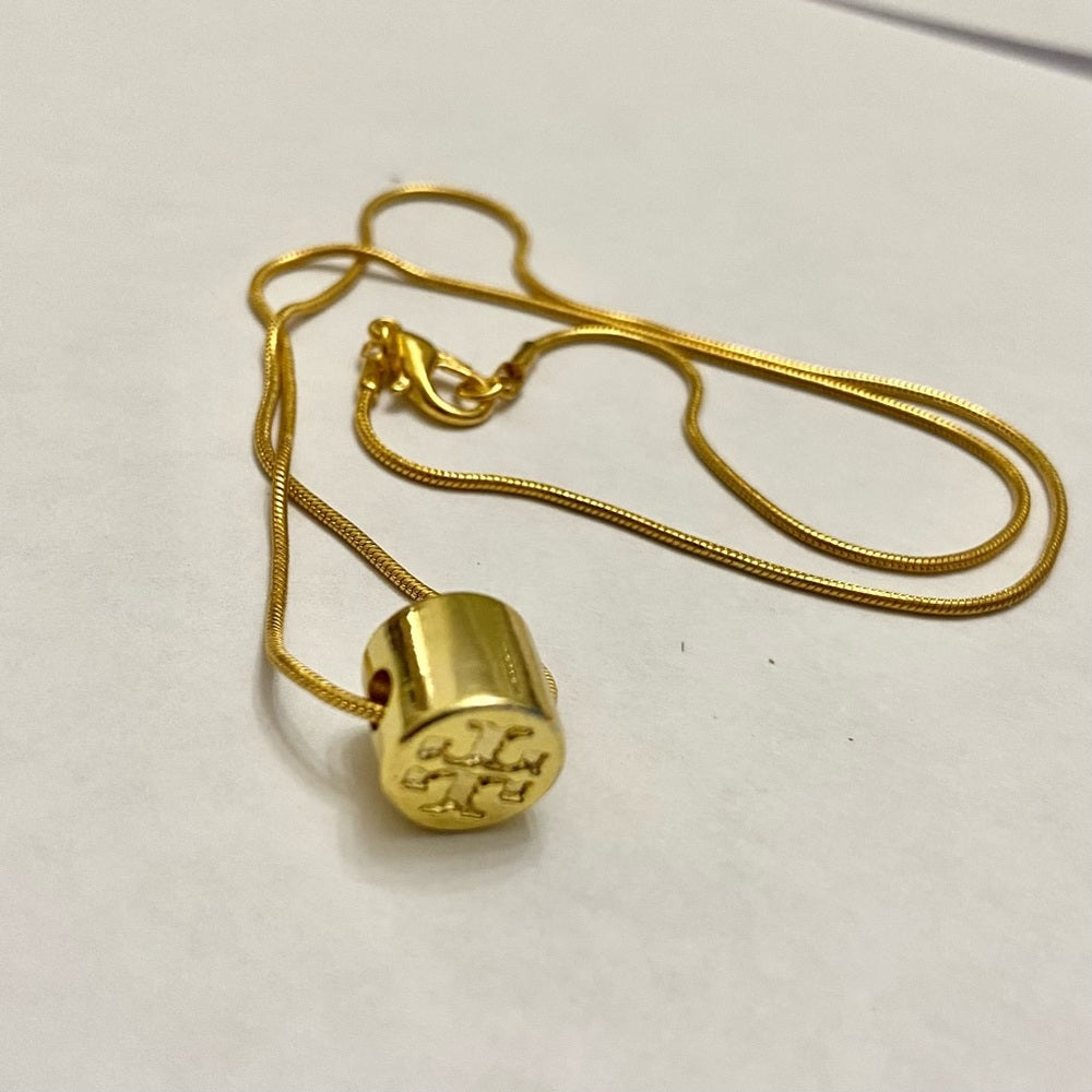 Tory Burch Gold Tone Charm with 18in Gold Plated Chain Necklace