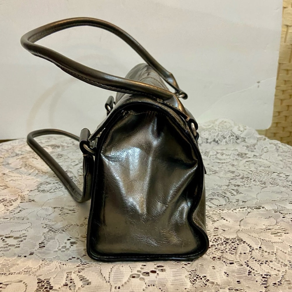 East 5th Metallic Silver Faux Leather Handbag. (13.5in x 7.5in x 3.5in)