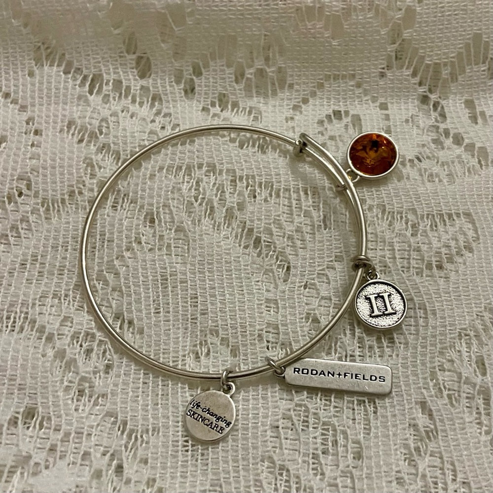 Lot of 2 Vintage Silver Tone Bracelets- Rodan Fields and Pink Agate Cuff Bangle