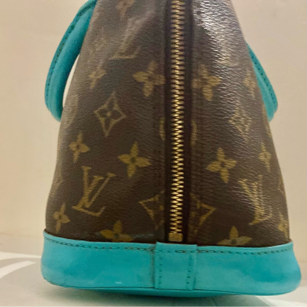 Louis Vuitton Alma Handbag w/ Aquamarine Leather Trim 10in x 12in x 6.5in