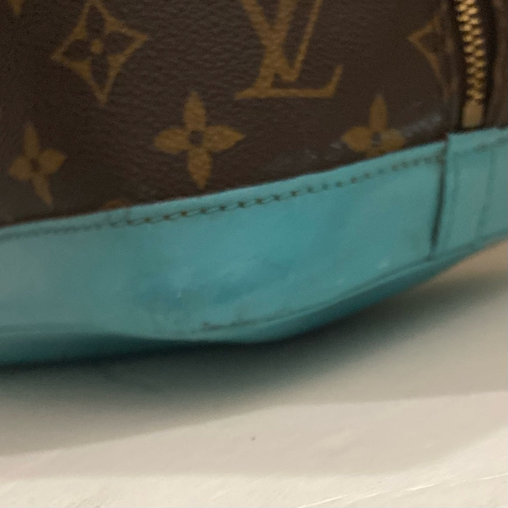 Louis Vuitton Alma Handbag w/ Aquamarine Leather Trim 10in x 12in x 6.5in