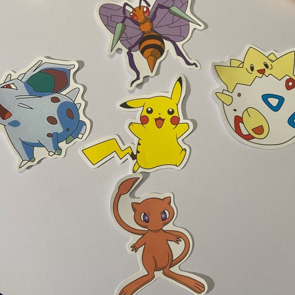 Lot of 8pc Pokemon Collectibles. (A)