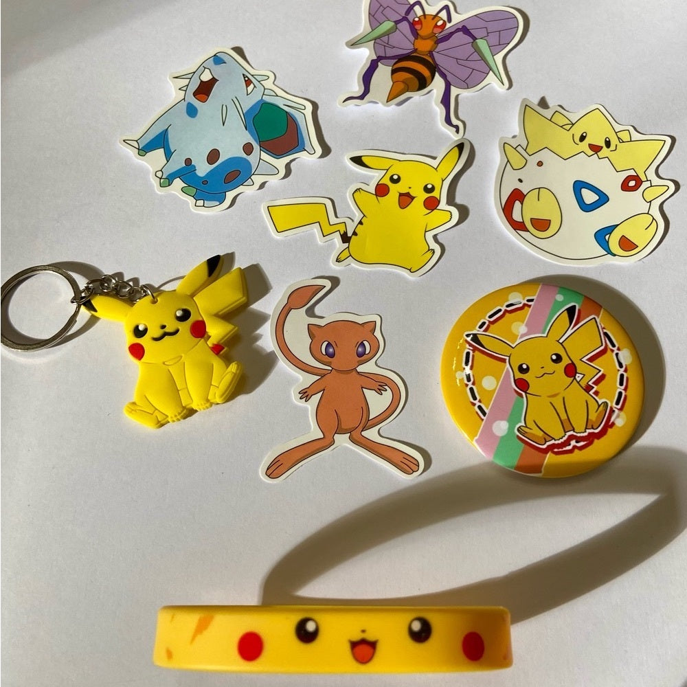 Lot of 8pc Pokemon Collectibles. (A)