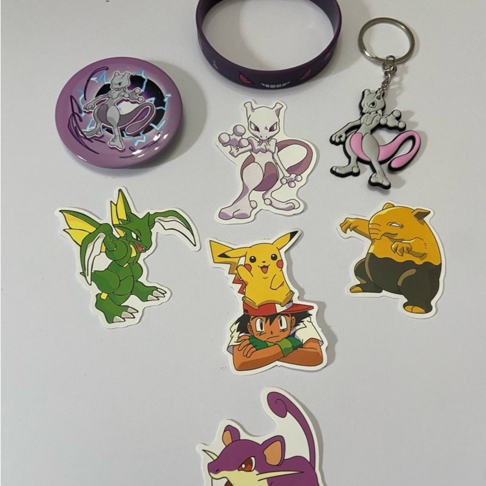 Lot of 8pc Pokemon Collectibles. (B)