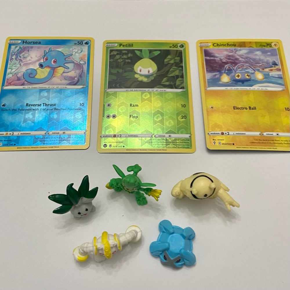 Lot (A): 3 Pokemon Reverse Holo Cards and 5 Pokemon Figures