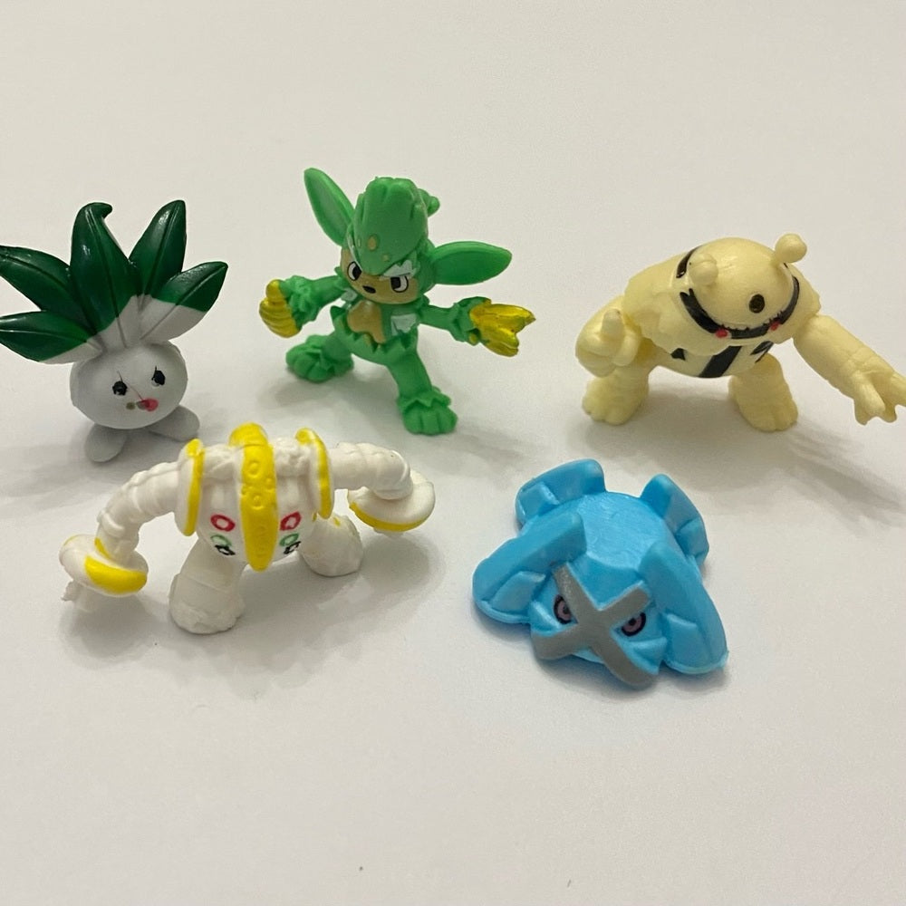 Lot (A): 3 Pokemon Reverse Holo Cards and 5 Pokemon Figures