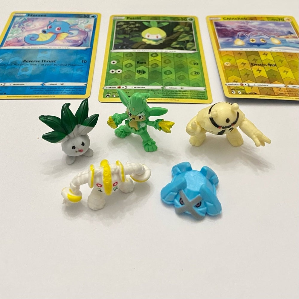 Lot (A): 3 Pokemon Reverse Holo Cards and 5 Pokemon Figures