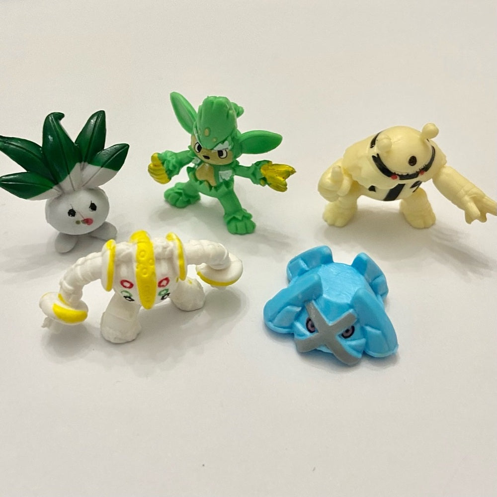Lot (A): 3 Pokemon Reverse Holo Cards and 5 Pokemon Figures