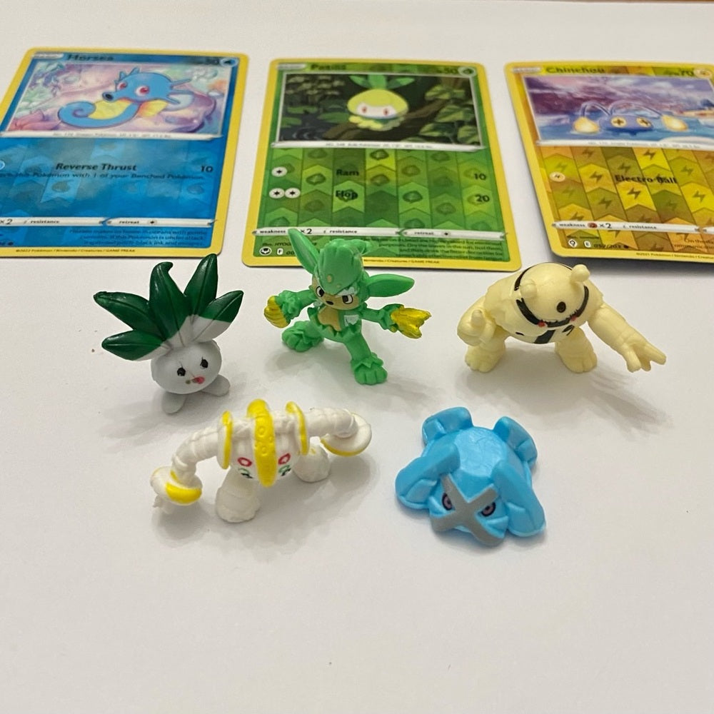 Lot (A): 3 Pokemon Reverse Holo Cards and 5 Pokemon Figures