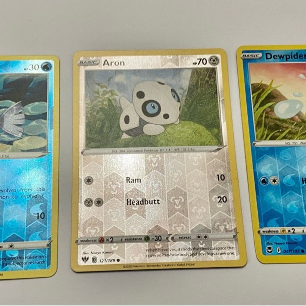 Lot (C): 3 Pokemon Reverse Holo Cards and 5 Pokemon Figures