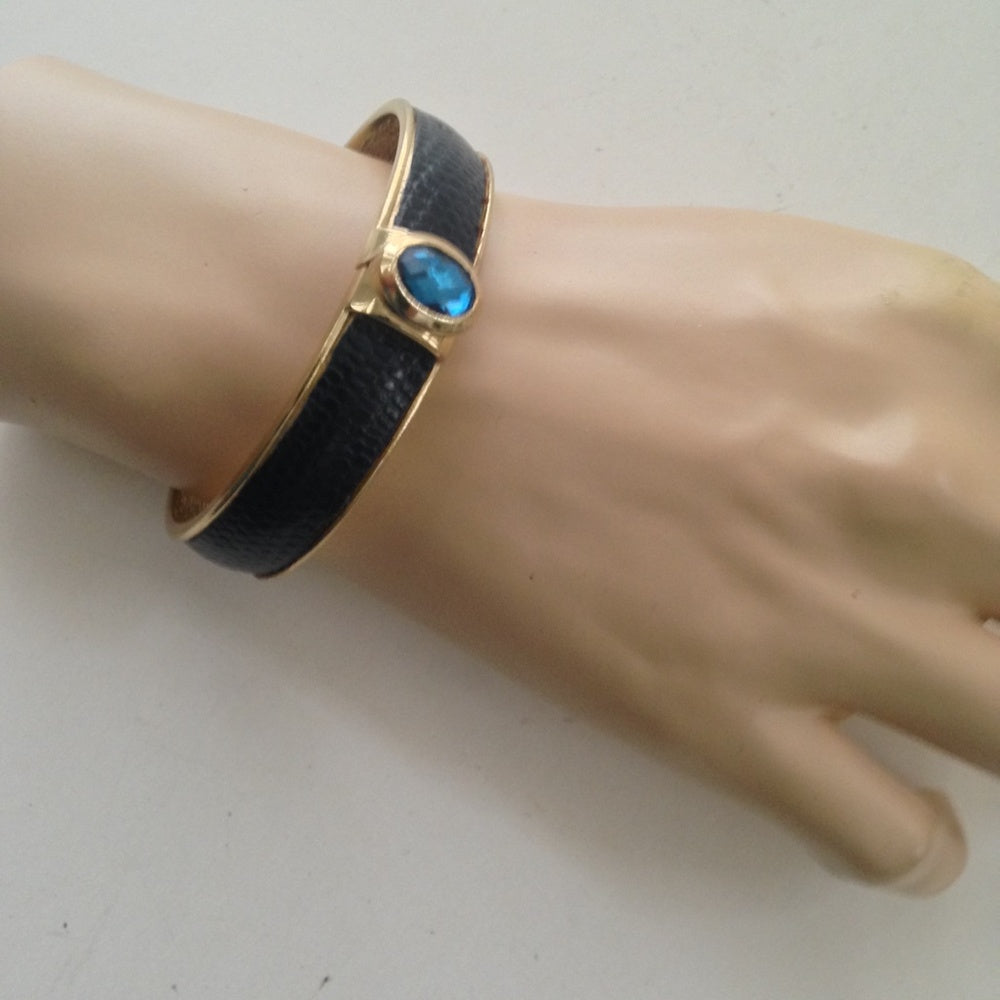 Vintage Gold Tone, Black Hinged Bangle Bracelet with Blue Faux Sapphire