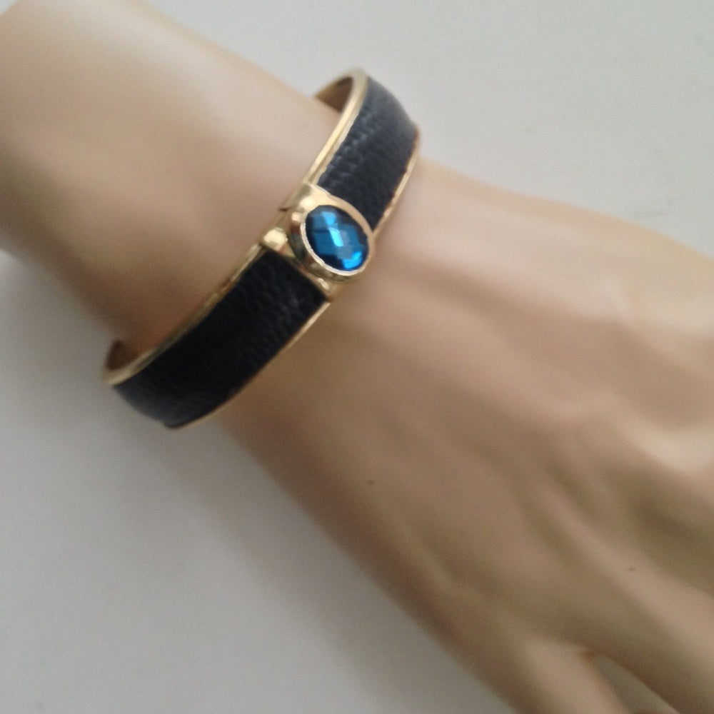 Vintage Gold Tone, Black Hinged Bangle Bracelet with Blue Faux Sapphire