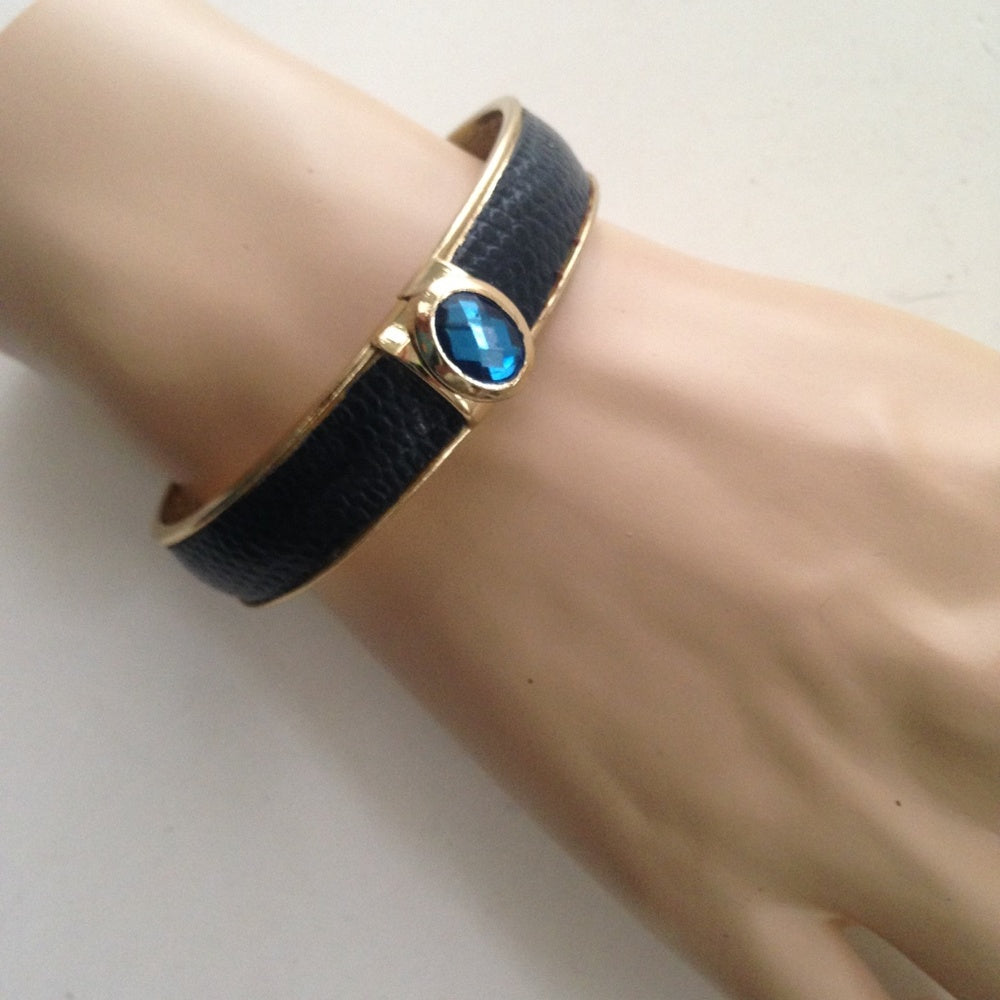Vintage Gold Tone, Black Hinged Bangle Bracelet with Blue Faux Sapphire