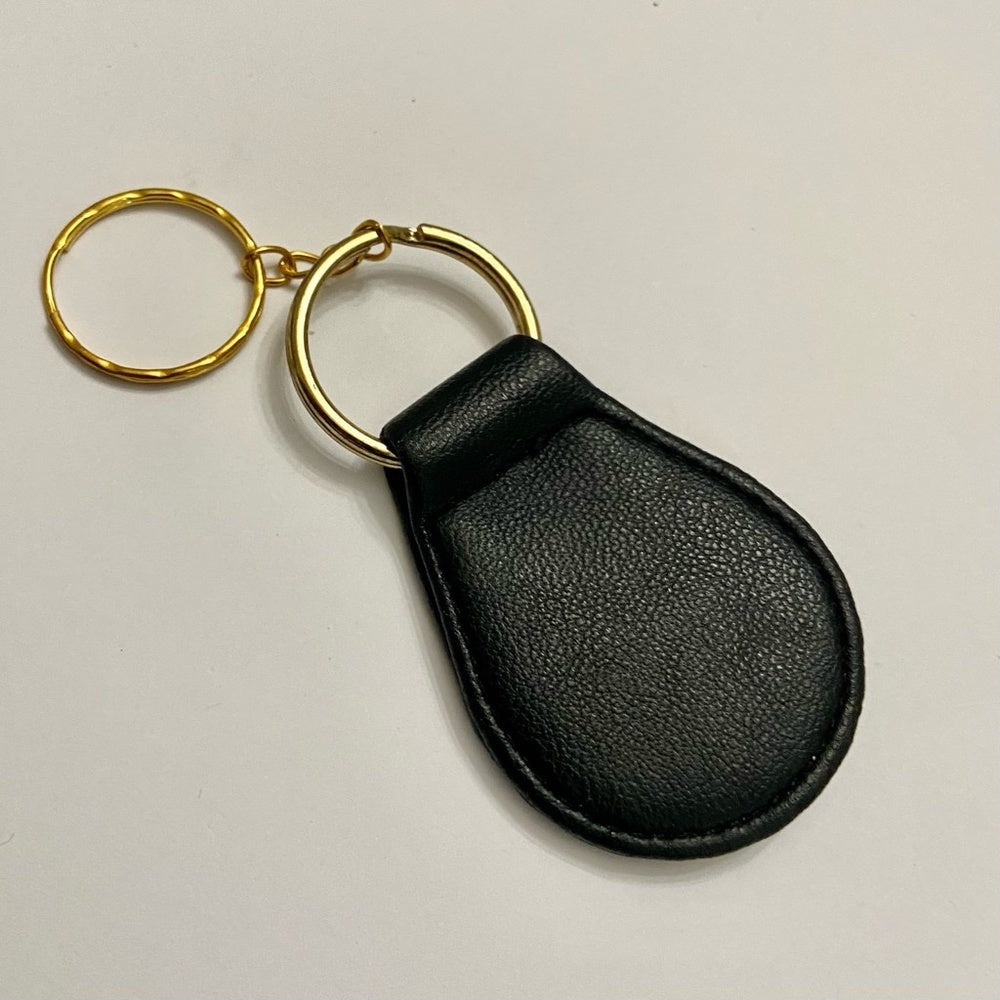Stunning, 2-Way, Embossed Carlos Santana Black Leather Handbag Charm-Key Chain