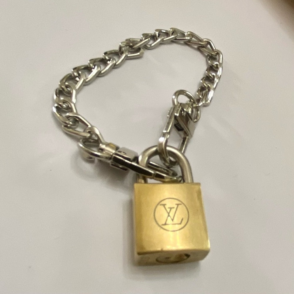Vintage, Louis Vuitton Brass Padlock with 7-8in Gold Tone Chain Bracelet (A)
