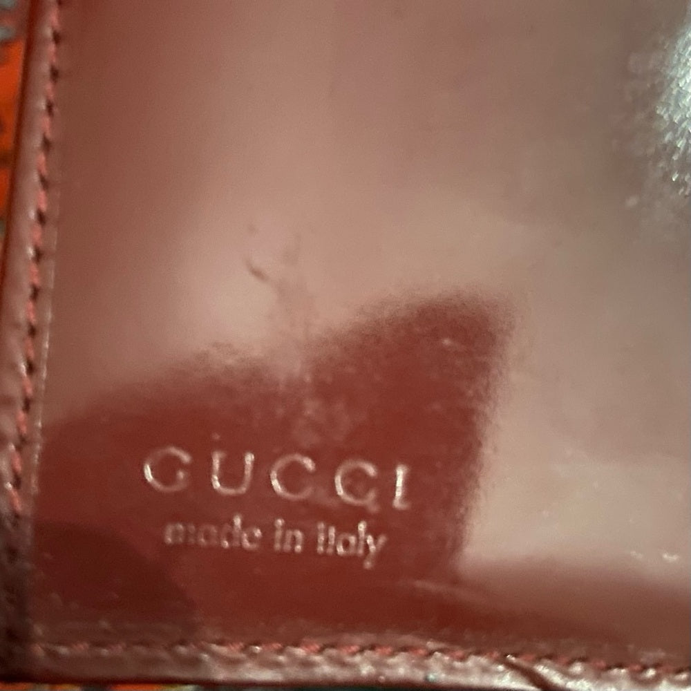 Authentic, Gucci Burgundy Enamel Trifold Unisex Wallet