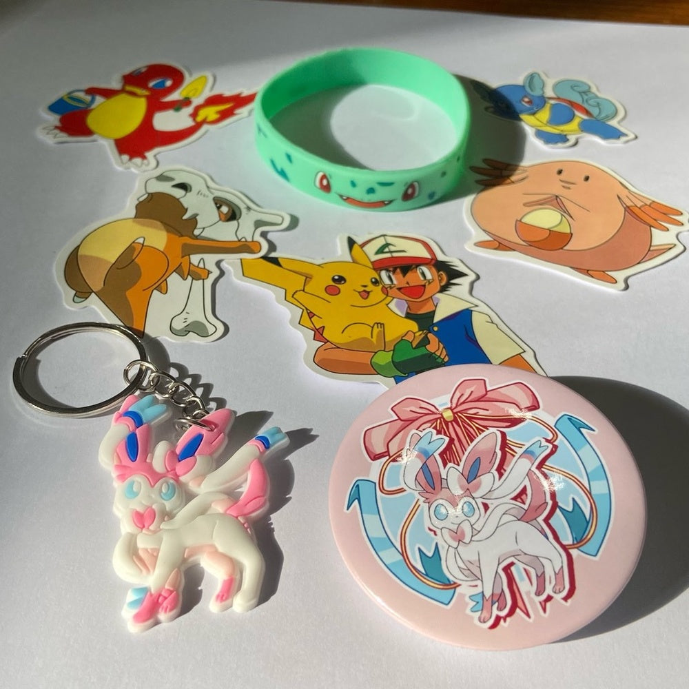 Lot of 8pc Pokemon Collectibles. (H)