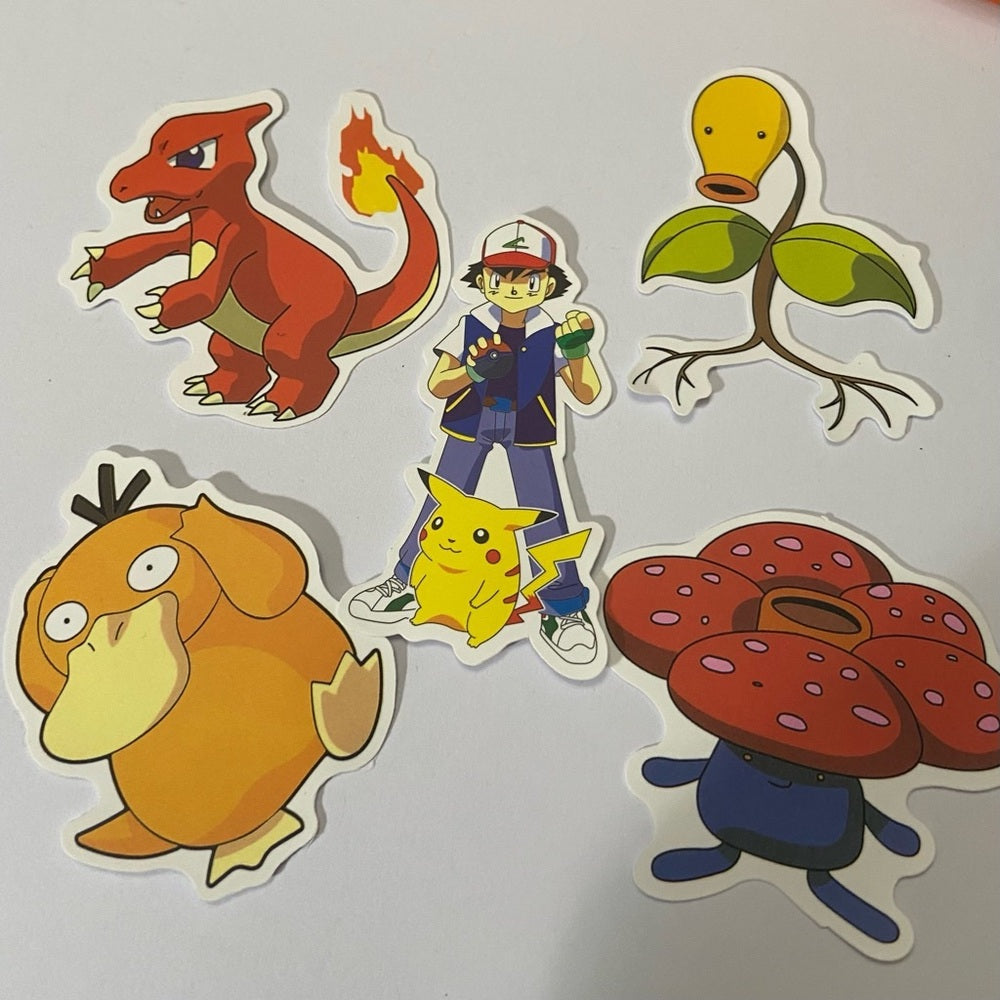 Lot of 8pc Pokemon Collectibles. (J)