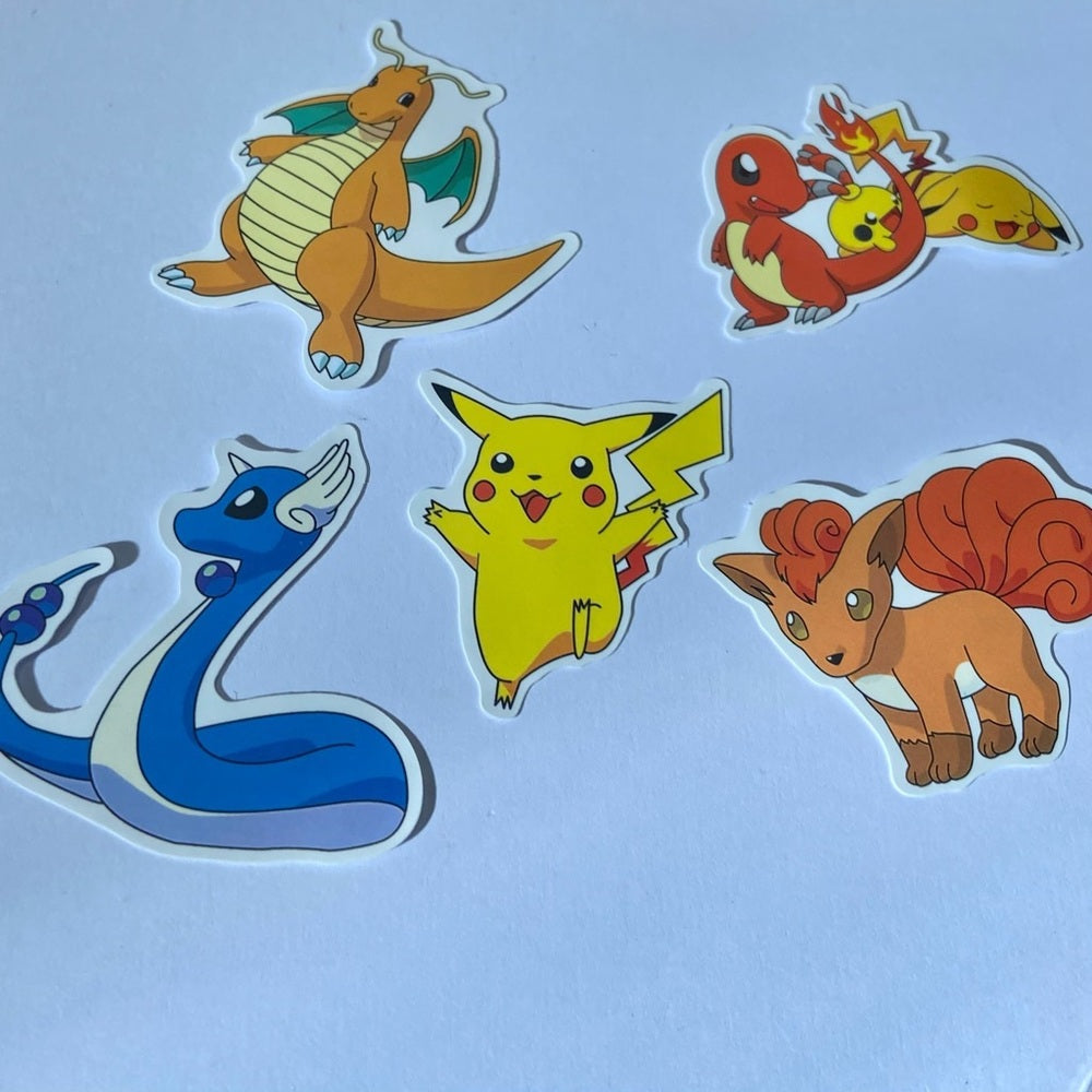 Lot of 8pc Pokemon Collectibles. (I)
