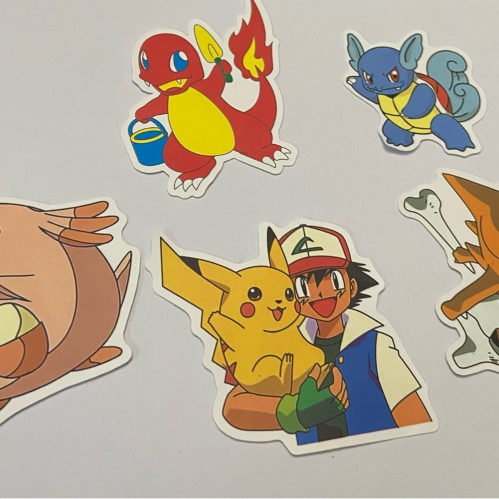 Lot of 8pc Pokemon Collectibles. (H)