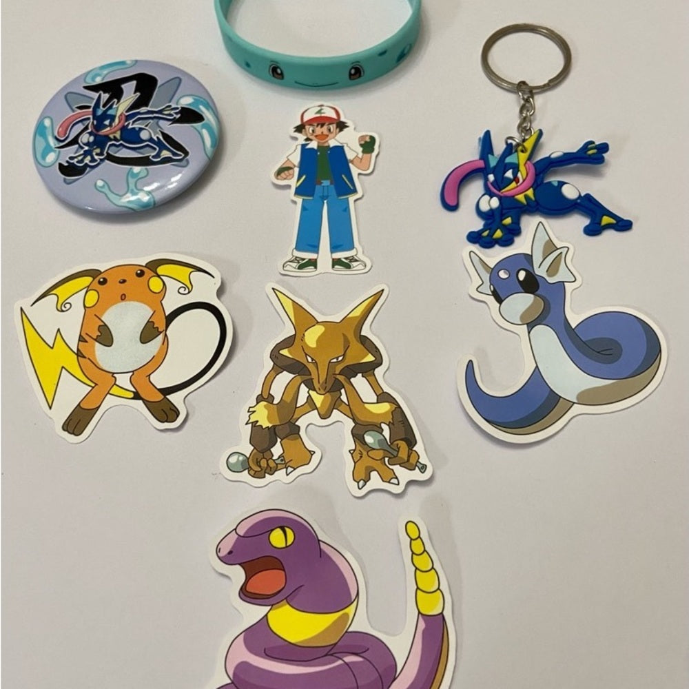 Lot of 8pc Pokemon Collectibles. (E)