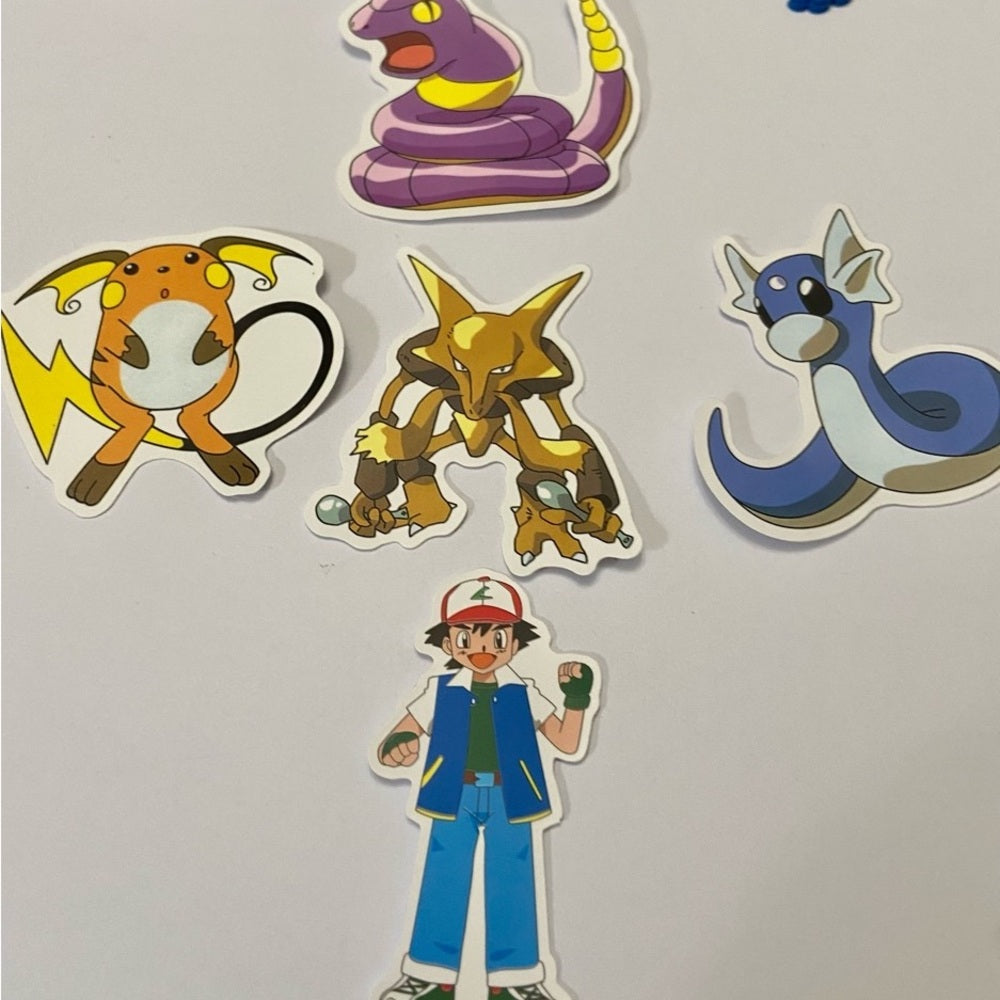 Lot of 8pc Pokemon Collectibles. (E)
