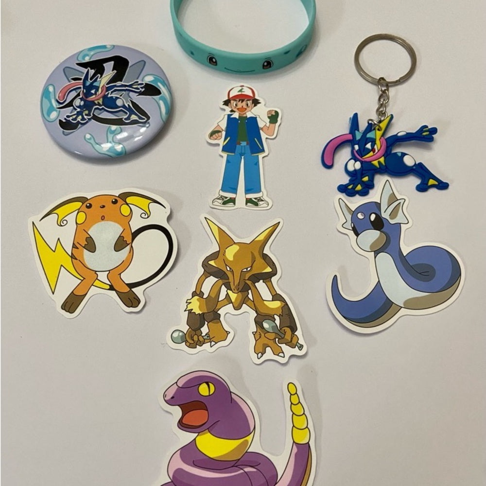 Lot of 8pc Pokemon Collectibles. (E)