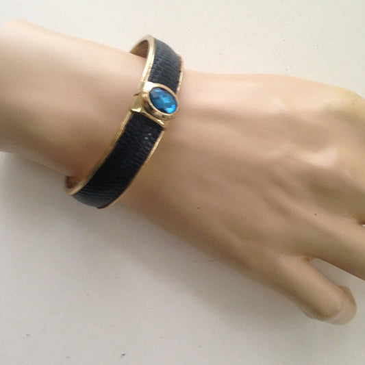 Vintage Gold Tone, Black Hinged Bangle Bracelet with Blue Faux Sapphire
